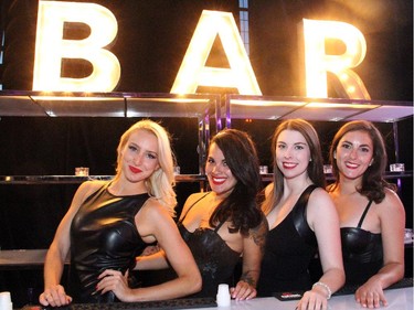From left, Leah Simpkins, Reyna Uriarte, Allyson Fraser and Stacey Doolan were on bartending duty at the Bash Noir benefit for the Snowsuit Fund held Lansdowne Park's Horticuture Building on Saturday, June 20, 2015.