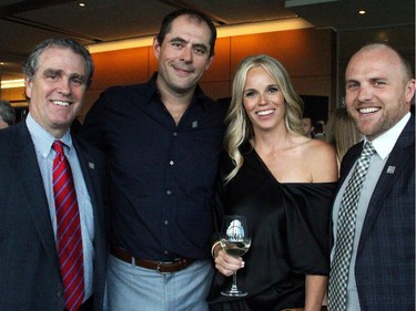 From left, Peter Candlish from CIBC Wood Gundy in Kingston with Ottawa Senators defenceman Chris Phillips and Erin Phillips and their friend Dean Usher, investment advisor with CIBC Wood Gundy at Ringside for Youth, held at the Shaw Centre on Thursday, June 11, 2015.
