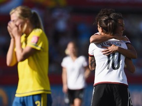 Dzsenifer Marozsan and Celia Sasic of Germany celebrate after the FIFA Women's World Cup round of 16 match between Germany and Sweden at Lansdowne Stadium on Saturday, June 20, 2015.