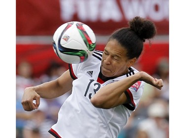 Germany's Celia Sasic (13) heads the ball in a match against Cote d'Ivoire during the FIFA Women's World Cup at TD Place in Ottawa Sunday June 07, 2015.