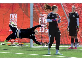 Germany's goalies (from left: captain Nadine Angerer, Laura Benkarth and Almuth Schult) practice at the net. The German FIFA women's soccer team practiced at Algonquin College Wednesday morning.