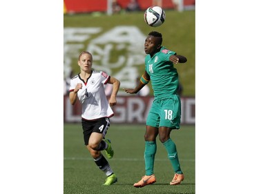 Germany's Leonie Maier (4) chases after Cote d'Ivoire's Binta Diakite (18) during the second half of their first match during the FIFA Women's World Cup at TD Place in Ottawa Sunday June 07, 2015.