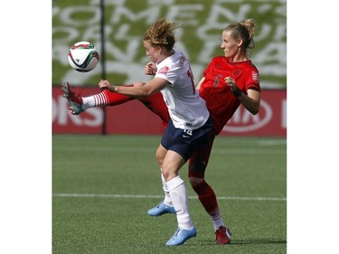 Germany's Simone Laudehr (6) kicks the ball out of the air and away from a pressing Ingrid Schjelderup (14) of Norway during the second half of their match during the 2015 FIFA Women's World Cup at Lansdowne Stadium Thursday June 11, 2015.