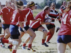 Rowan Stringer carries the ball during one of her high school rugby games.