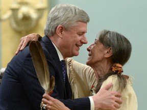 Prime Minister Stephen Harper hugs Elder Evelyn Commanda-Dewache, a residential school survivor, during the closing ceremony of the Indian Residential Schools Truth and Reconciliation Commission, at Rideau Hall on Wednesday.