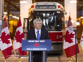 Prime Minister Stephen Harper announces transit funding recently in Toronto. But his image will be partly shaped in the pre-election period by third party advertisers, not just his own election machine.