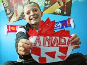 Jordan Tate is obsessed with soccer in the way other girls her age fixate on their smartphones or One Direction. When she's not hitting the field three or four times a week with Ottawa South United, one of the city's biggest clubs, she's at home practising.  She is seen holding the Team Canada logo she drew a couple years ago after being inspired by the national women's team Olympics run in 2012.   (Jean Levac/ Ottawa Citizen)