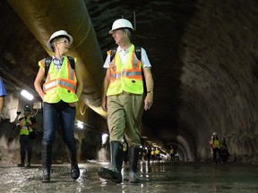 Ontario Premier Kathleen Wynne, Ottawa Mayor Jim Watson tour the tunnel that is part of the first stage of Ottawa's light-rail system.