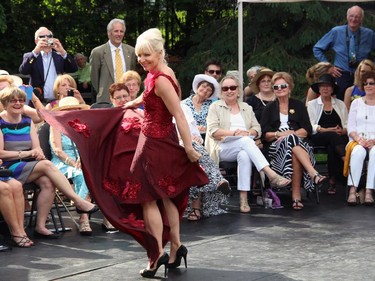 Kathy Godding gives a spin (and shows off her toned calves) as one of the models in the Sukhoo Sukhoo fashion show held during the annual garden party for Cornerstone Housing for Women on Sunday, June 7, 2015, at the official residence of the Irish ambassador.