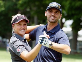 Brooke Henderson of Canada poses with Dancing With the Stars dancer Tony Dovolani during the pro-am held before the start of the KPMG Women's PGA Championship at the Westchester Country Club in Harrison, New York.