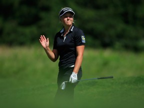 Brooke Henderson, seen acknowledging the gallery after her second shot on the 10th hole during the third round of the KPMG Women's PGA Championship, can earn her LPGA Tour card for 2016 if she can pull in enough money in 2015.