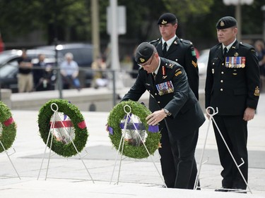 Lieutenant General Marquis Haines lays the wreath at the 62nd anniversary of the Korean War Armistice at War Memorial in Ottawa on Sunday, June 21, 2015.