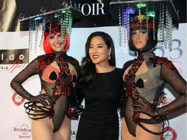 Lois Lee, from CTV Morning Live, with a pair of exotic models on the red carpet for the Bash Noir party, held at Lansdowne Park's Horticulture Building on Saturday, June 20, 2015.