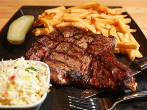 Mark Cantor holds a rib steak platter from The Butchery on Robertson Rd. in Ottawa.  (Jean Levac/ Ottawa Citizen) ORG XMIT: 0611 dining