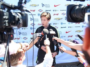 Meghan Klingenberg of the U.S. women's soccer  team talks to the media.