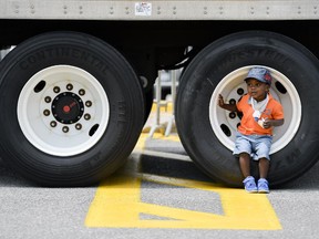 Mikai Bafi-Yeboa checks out one of the trucks at Mothercraft Touch a Truck event held at Lincoln Fields shopping centre on Sunday, June 14, 2014. (James Park / Ottawa Citizen)