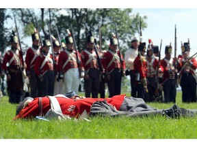 MORRISBURG, ON. JULY 13, 2013--- The 200th anniversary celebration of the Battle of Crysler's Farm drew a total of 800 re-enactors and about 6,000 spectators to the War of 1812 site beside Upper Canada Village Saturday.   About 500 re-enactment soldiers commemorated the Bicentennial of the "Battle that Saved Canada," where 1,200 soldiers beat back an American Army three times its size.  The celebration takes place all weekend at the historic site.  (Julie Oliver/Ottawa Citizen)#113633. CITY.