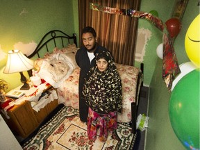 Nejat Ali Mohammed and son Naser Ali Ahmed in the bedroom of Ahmed Ali Ahmed, who she thought would be released from custody Friday.