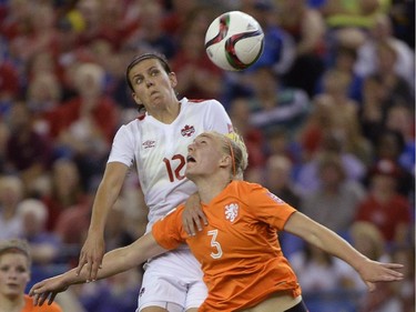 Netherlands' Stefanie Van Der Gragt (3) and Canada's Christine Sinclair (12)battle for the ball during second half FIFA Women's World Cup soccer in Montreal on Monday, June 15, 2015.