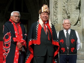 Leaders of the Nisga'a Tribal Council including President Joseph Gosnell (centre), Rod Robinson (left), and Frank Calder (right) who initiated the Nisga'a legal struggle in Ottawa in 1961, prepare to enter the Parliament building in Ottawa to hear a Speech from the Throne, in which the government pledged to ratify the Nisga'a Treaty, in 1999.
