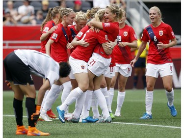 Norway celebrates a goal by Ada Hegerberg (21) on Thailand's Waraporn Boonsing (1) during the second half of their first match of the FIFA Women's World Cup at TD Place in Ottawa Saturday June 07, 2014. Norway won 4-0.