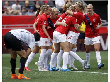 Norway celebrates a goal by Ada Hegerberg (21) on Thailand's Waraporn Boonsing (1) during the second half of their first match of the FIFA Women's World Cup at TD Place in Ottawa Saturday June 07, 2014. Norway won 4-0.