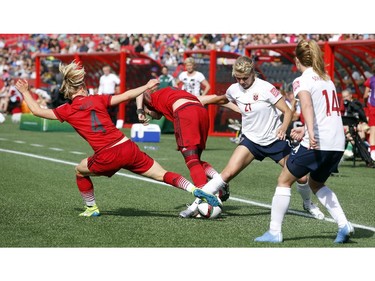 Norway's Ada Hegerberg (21) steals the ball from Germany's Leonie Maier (4) and Simone Laudehr (6) while teammate Ingrid Schjelderup (14) looks on during the second half of their match during the 2015 FIFA Women's World Cup at Lansdowne Stadium Thursday June 11, 2015.