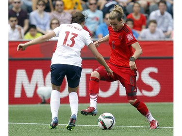 Norway's Ingrid Moe Wold (13) keeps her eyes on the foot work of Germany's Simone Laudehr (6) during the first half of their match during the 2015 FIFA Women's World Cup at Lansdowne Stadium Thursday June 11, 2015.