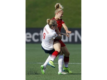 Norway's Isabell Herlovsen (9) and Germany's Leonie Maier (4) collide during the second half of their match during the 2015 FIFA Women's World Cup at Lansdowne Stadium Thursday June 11, 2015.