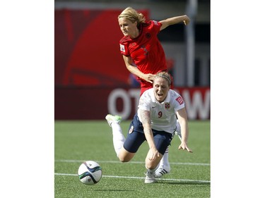 Norway's Isabell Herlovsen (9) is tripped by Germany's Saskia Bartusiak (3) during the second half of their match during the 2015 FIFA Women's World Cup at Lansdowne Stadium Thursday June 11, 2015. The play led to a penalty shot by Norway's Maren Mjelde (6) who scored to tie the game. Germany and Norway tied 1-1.