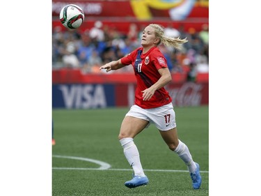 Norway's Lene Mykjaland (17) chases a loose ball while playing Thailand during the second half of their first match of the FIFA Women's World Cup at TD Place in Ottawa Saturday June 07, 2014. Norway won 4-0.