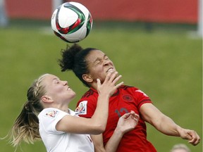 Norway's Marita Skammelsrud Lund (3) challenges Celia Sasic (13) of Germany for the ball during the first half of their match during the 2015 FIFA Women's World Cup at Lansdowne Stadium Thursday June 11, 2015.