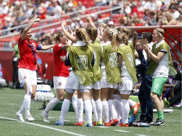 Norway's Trine Ronning (7), left, celebrates Isabell Herlovsen's (9) first of two goals in the first half against Thailand during the first half of their first match of the FIFA Women's World Cup at TD Place in Ottawa Sunday June 07, 2015.