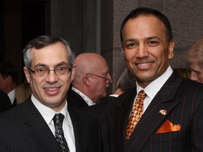 Vijay Kanwar (right) chairs a new advisory committee on senior level public servant retention and compensation. He was appointed by Treasury Board President Tony Clement (left).