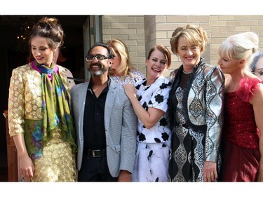 Ottawa couturier Frank Sukhoo is seen with a bevy of models from the fashion show he presented during the annual garden party for Cornerstone Housing for Women on Sunday, June 7, 2015, at the official residence of the Irish ambassador.
