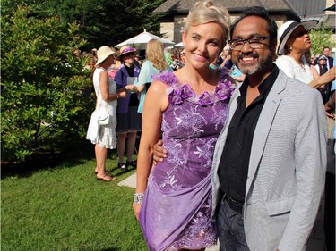 Ottawa couturier Frank Sukhoo, seen with client and friend Whitney Fox at the Irish ambassador's residence on Sunday, June 7, 2015, has been putting on a fashion show for Cornerstone Housing for Women for the past 10 years