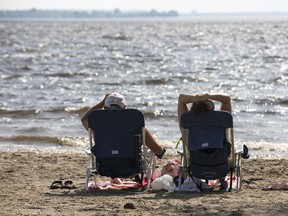 A couple relaxes at Westboro Beach