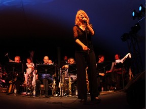 Maria Schneider talks to the crowd after conducting a piece with the Maria Schneider Orchestra  during the 2009 Ottawa International Jazz Festival.