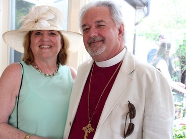 Ottawa's Anglican Bishop John Chapman with his wife, Catherine, at the annual garden party and fashion show for Cornerstone Housing for Women, held Sunday, June 7, 2015, at the official residence of the Irish ambassador.