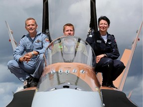 Retired astronaut and International Space Station Commander, Chris Hadfield, left, greeted CF-18 pilot Denis Beauliau, centre, and Canada’s only female Snowbird pilot and commander, Maryse Carmichael, right.