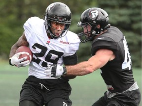 Running back Chevon Walker outpaces a tackle on day three of  Redblacks training camp.