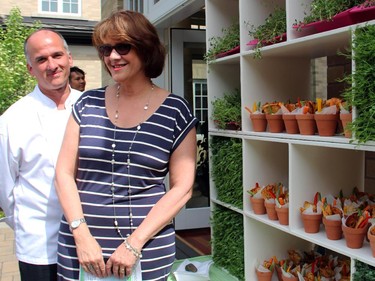 Sheila Whyte, owner of Thyme & Again catering, with the Irish Embassy's new chef, Michael Sobcov, and her edible food garden at annual benefit for Cornerstone Housing for Women, held at the Irish ambassador's residence on Sunday, June 7, 2015.