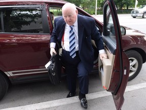 Suspended Senator Mike Duffy heads to court in Ottawa on Monday, June 1, 2015. Duffy faces 31 charges, including fraud, breach of trust and bribery.