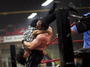 Suspended senator Patrick Brazeau participates at Great North Wrestling match as a special guest referee at Earl Armstrong centre on Saturday, May 30, 2015. Brazeau refereed a heavy weight championship match between Hannibal (Devon Nicholson) and Soa Amin (Rodney Kellman) where Brazeau himself was later drawn into the match and ultimately thrown onto a table by the ringside.