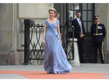 Queen Mathilde of Belgium arrives for the wedding of Sweden's Crown Prince Carl Philip and Sofia Hellqvist at Stockholm Palace on June 13, 2015.