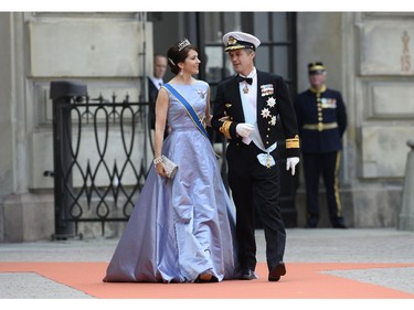 Crown Princess Mary of Denmark, left, and Crown Prince Frederik of Denmark arrive for the wedding of Sweden's Crown Prince Carl Philip and Sofia Hellqvist at Stockholm Palace on June 13, 2015.