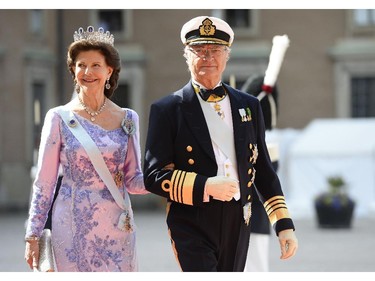 Sweden's Queen Silvia, left, and Sweden's King Carl XVI Gustaf arrive for the wedding of Sweden's Crown Prince Carl Philip and Sofia Hellqvist at Stockholm Palace on June 13, 2015.