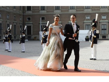 Sweden's Crown Princess Victoria, left, and Sweden's Prince Daniel arrive for the wedding of Sweden's Crown Prince Carl Philip and Sofia Hellqvist at Stockholm Palace on June 13, 2015.