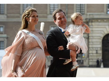 From left, Sweden's Princess Madeleine, Christopher ONeill and Princess Leonore arrive for the wedding of Sweden's Crown Prince Carl Philip and Sofia Hellqvist at Stockholm Palace on June 13, 2015.