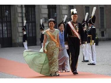Princess Hisako Takamado of Japan, left, arrives for the wedding of Sweden's Crown Prince Carl Philip and Sofia Hellqvist at Stockholm Palace on June 13, 2015.
